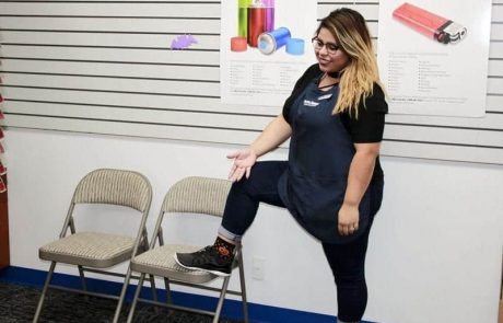 An employee showing her Halloween socks